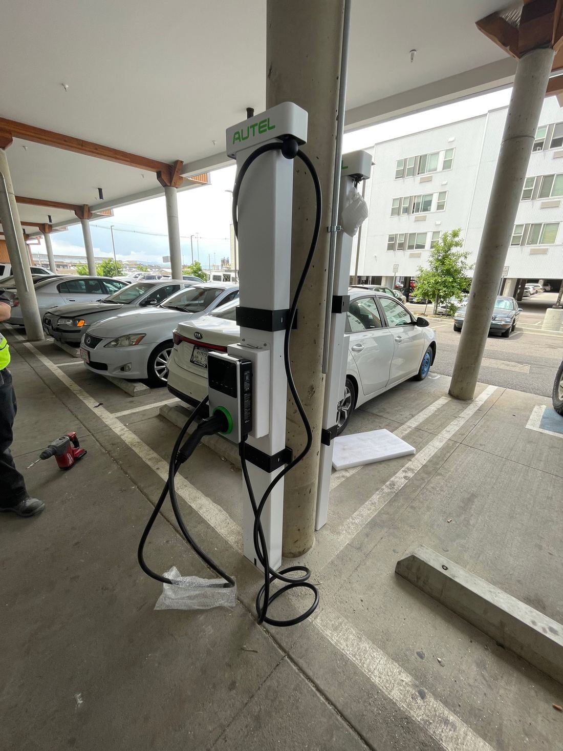 Column-mounted charger under a carport
