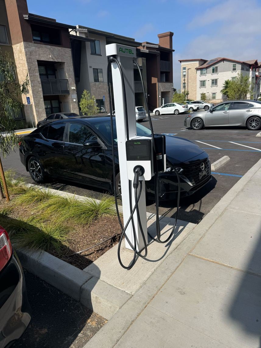 Curbside pedestal charging at an apartment community